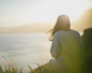 Woman looking into sunset