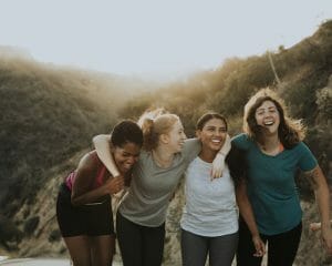 Group of women standing against the backdrop of a mountain